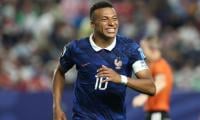 Mbappe scores twice as France beat Iraq at World Cup after two-hour storm delay
