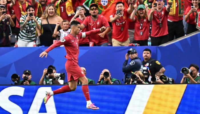 Portugals Cristiano Ronaldo celebrates scoring their third goal. — Reuters