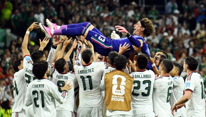 Mexico players celebrate goalkeeper Guillermo Ochoas first appearance in his sixth Fifa World Cup by tossing him into the air after the Group A match against the Czech Republic at Estadio Azteca, Mexico City, Mexico, on June 24, 2026. — Reuters