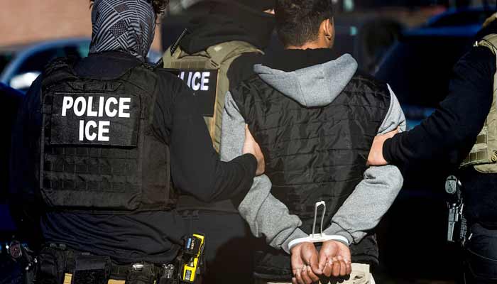Immigration and Customs Enforcement agents detain a man after conducting a raid at the Cedar Run apartment complex in Denver, Colorado, US, February 5, 2025.— Reuters/File