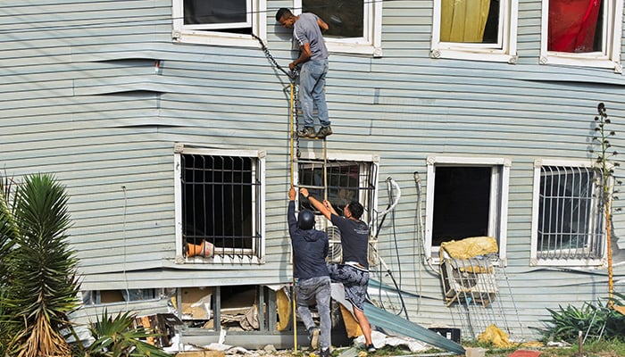 People take part in rescue efforts in the aftermath of earthquakes in La Guaira, Venezuela, June 25, 2026. — Reuters