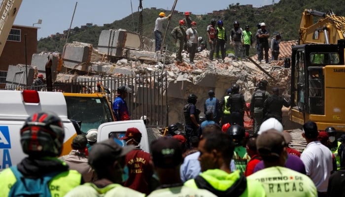 Emergency services work at the site of a collapsed building following earthquakes that hit the country, in Caracas, Venezuela, June 26, 2026. — Reuters