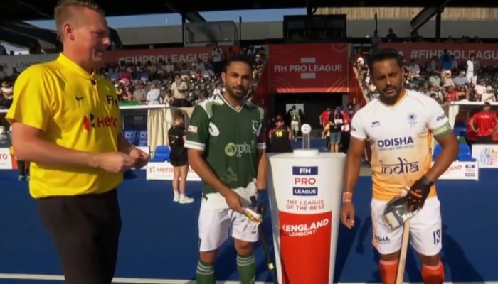 This image shows the captains of the Pakistan and India national field hockey teams standing together with an umpire at a FIH Pro League match. — Geo Super/File