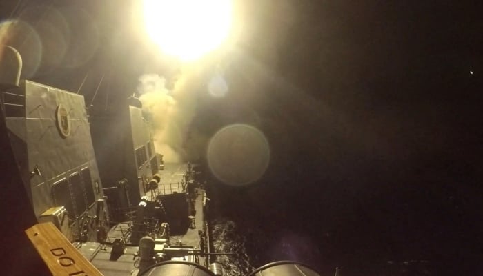 USS Michael Murphy (DDG 112) launches Tomahawk cruise missiles from an unknown location to target sites in Iran in this still image obtained from a handout video released on June 10, 2026. — Reuters