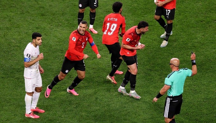Egypt players react as referee Szymon Marciniak calls an offside violation and overturns the goal by Shoja Khalilzadeh #4 of IR Iran during the FIFA World Cup 2026 Group G match between Egypt and IR Iran at Seattle Stadium on June 26, 2026 in Seattle, Washington, US. — AFP