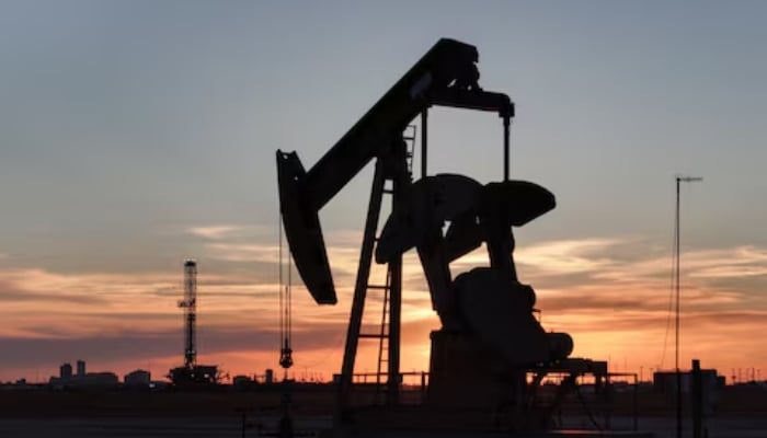 A drone view of a pump jack and drilling rig south of Midland, Texas, US June 11, 2025. — Reuters