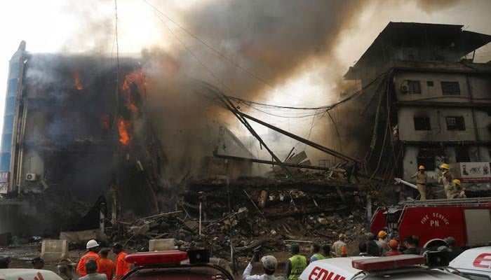 Flames and smoke rise from a fire that broke out in the Gul Plaza Shopping Centre in Karachi, Pakistan, January 18, 2026. — Reuters