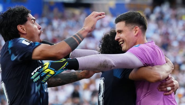 Paraguays Gustavo Gomez, Jose Canale and Orlando Gill celebrate winning the penalty shootout as Paraguay qualify for the round of 16 stage of the World Cup. — Reuters