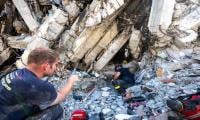 Twin earthquakes kill 1,719 in Venezuela as survivors await govt aid