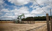 Oil prices slide, set for monthly decline as markets watch US-Iran talks