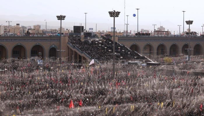 Massive crowds of grieving Iranians form dense rows to perform the funeral prayer over the bodies of Irans martyred Supreme Leader and his family at the Imam Khomeini Grand Mosalla in Tehran, Iran, July 5, 2026. — X/@IrnaEnglish